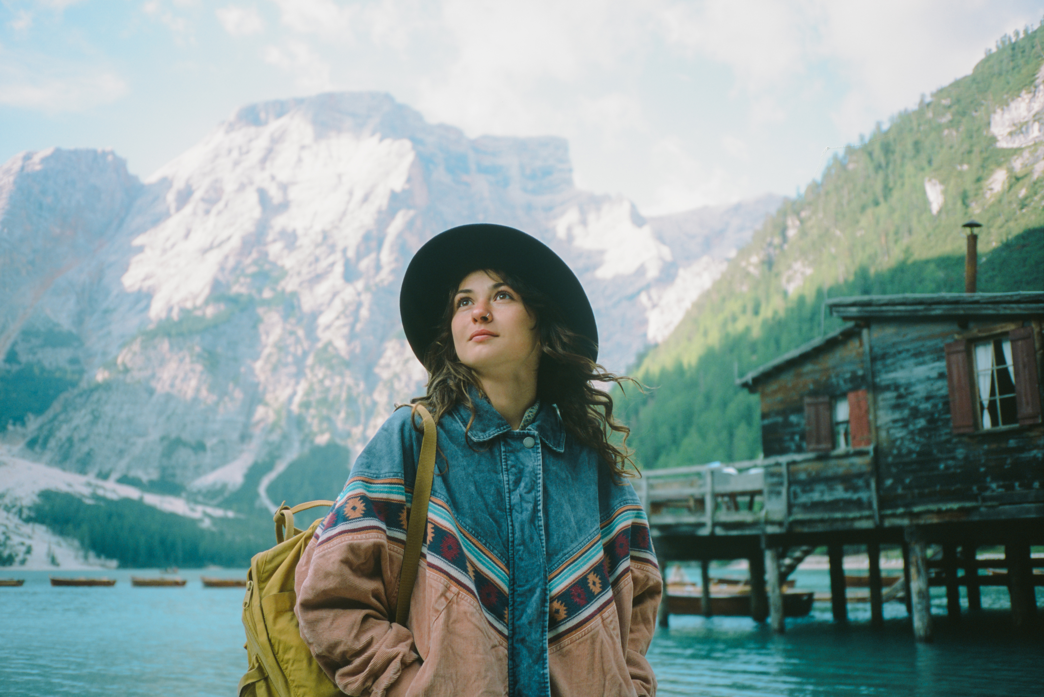 young woman at the lake, looking at the view